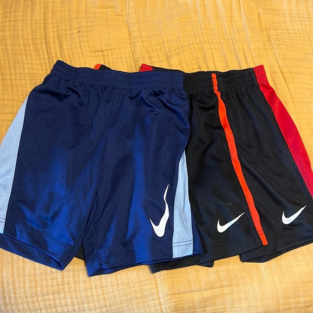 Three pairs Nike shorts size 7.